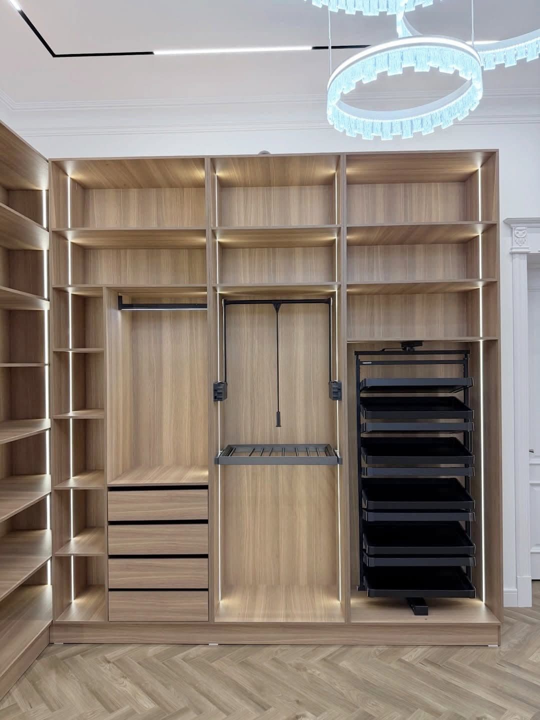 Corner walk-in closet with pull-down rails and accessory drawer tower - bespoke joinery by Royalwoods Interiors, Nairobi