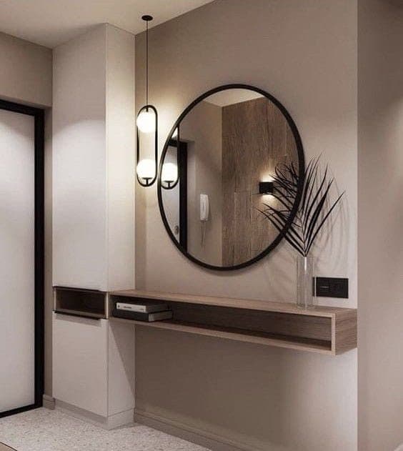 Floating oak vanity shelf with round mirror and drop pendant - bespoke joinery by Royalwoods Interiors, Nairobi