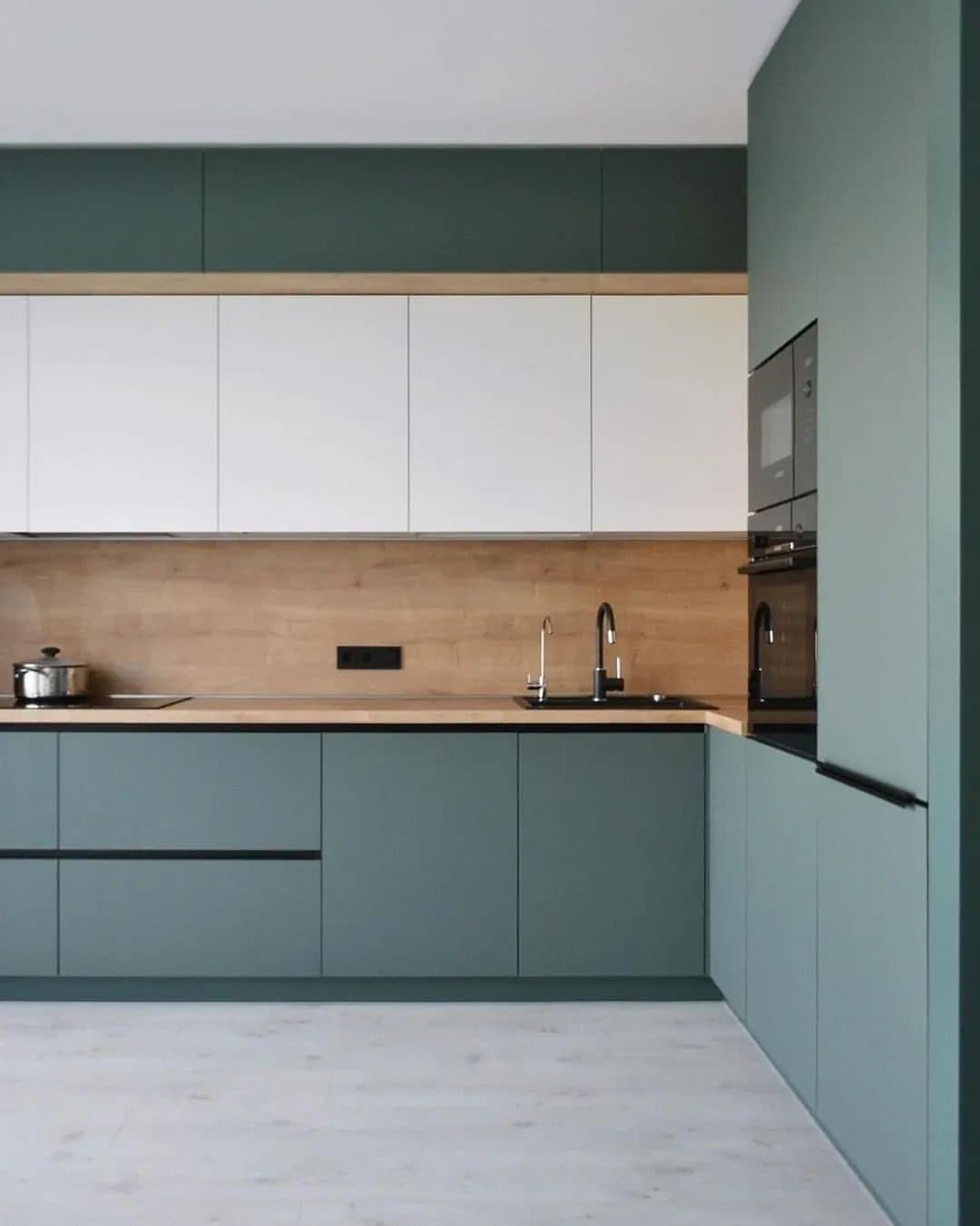 Corner run of the sage kitchen - handle-less fronts, recessed grip rails - bespoke joinery by Royalwoods Interiors, Nairobi