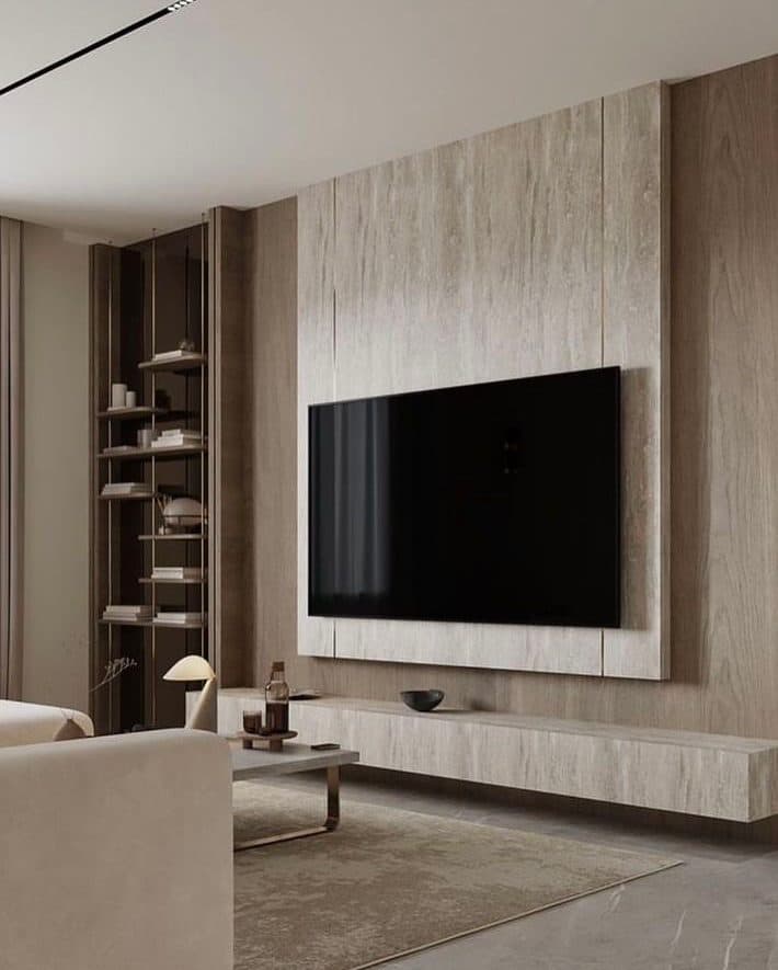 Travertine-clad TV feature wall with floating console and shadow-gap lighting - bespoke joinery by Royalwoods Interiors, Nairobi