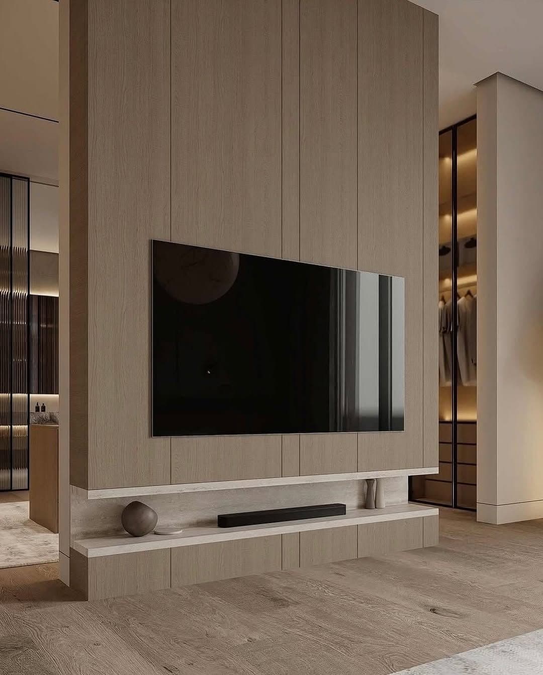 Media wall flowing into a lit walk-in closet beyond - bespoke joinery by Royalwoods Interiors, Nairobi