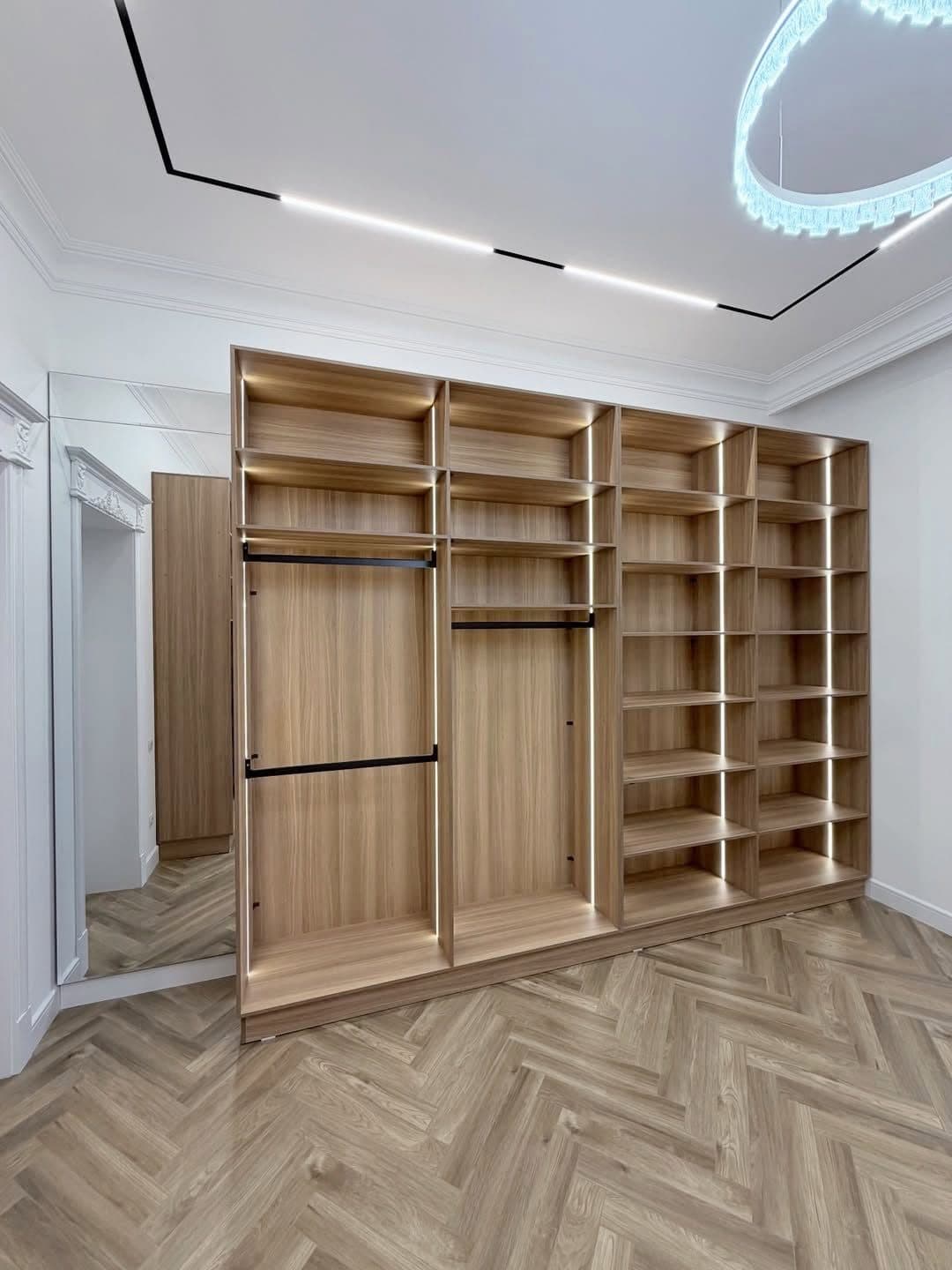 Walk-in closet composition finished with classical cornice and herringbone floor - bespoke joinery by Royalwoods Interiors, Nairobi
