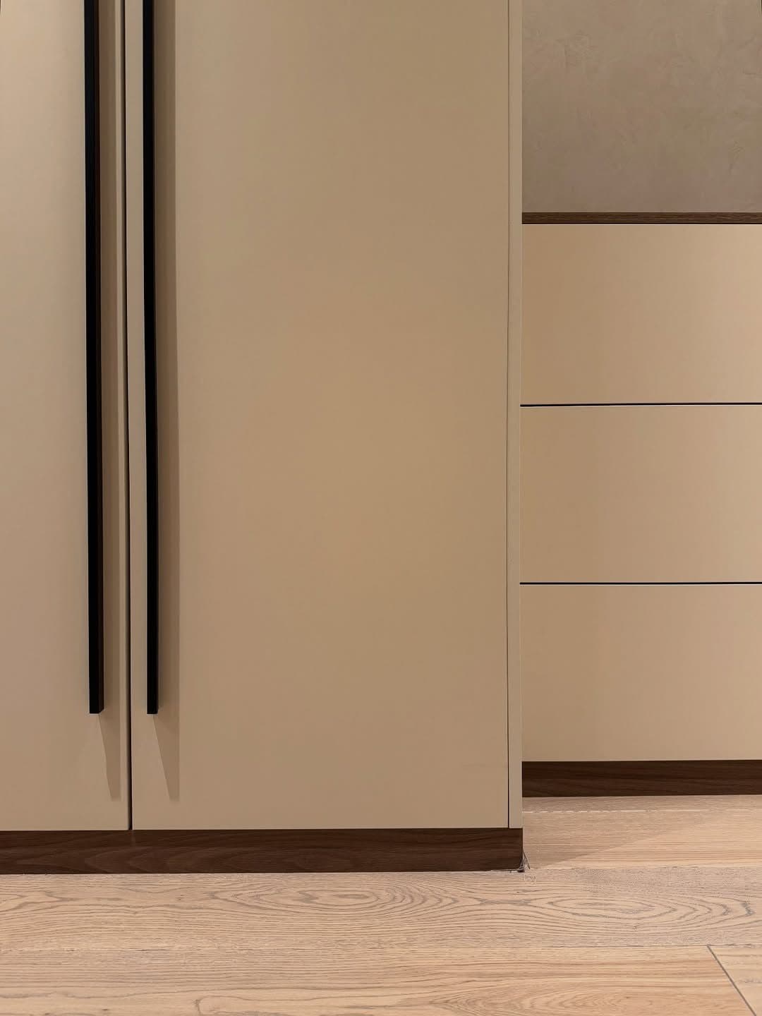 Detail: recessed pull rail and drawer stack junction on a fitted wardrobe - bespoke joinery by Royalwoods Interiors, Nairobi