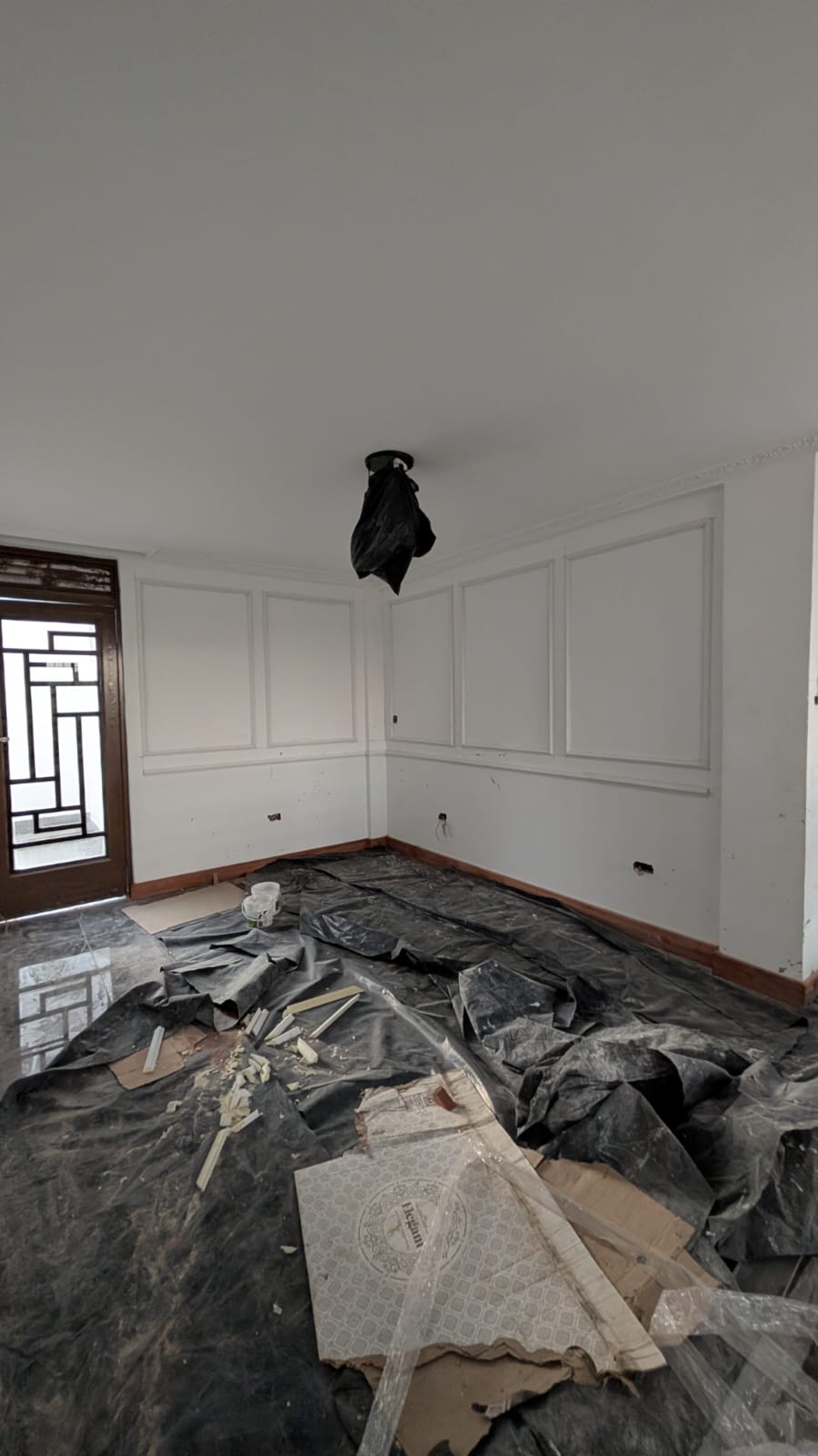 Panelled gallery corridor beneath a skylight with mahogany balustrade